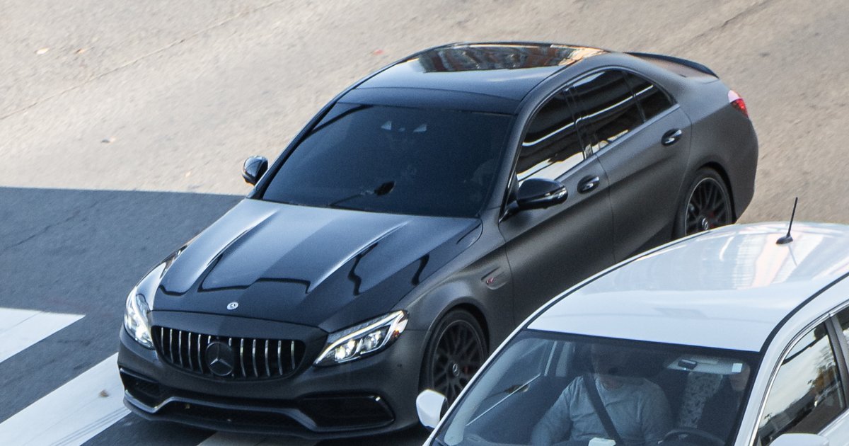 Mercedes-AMG C63 S sedan parked, rear-quarter view, highlighting the performance C-Class AMG variant