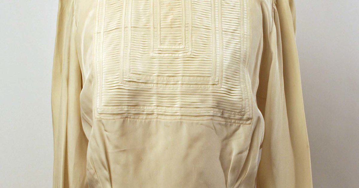 Vintage silk blouse, illustrating the craftsmanship, fabric, and design details of a luxury garment