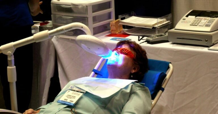 Person receiving an in-office teeth whitening treatment, illustrating modern whitening kit results