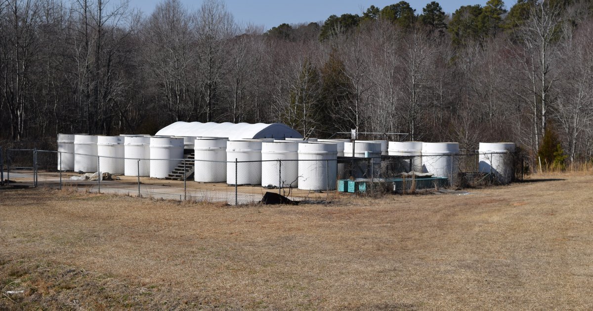 Industrial fiberglass reinforced plastic tanks, illustrating FRP construction and nozzle repair work