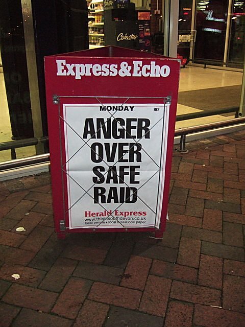 Newspaper headline sign for review metaphor